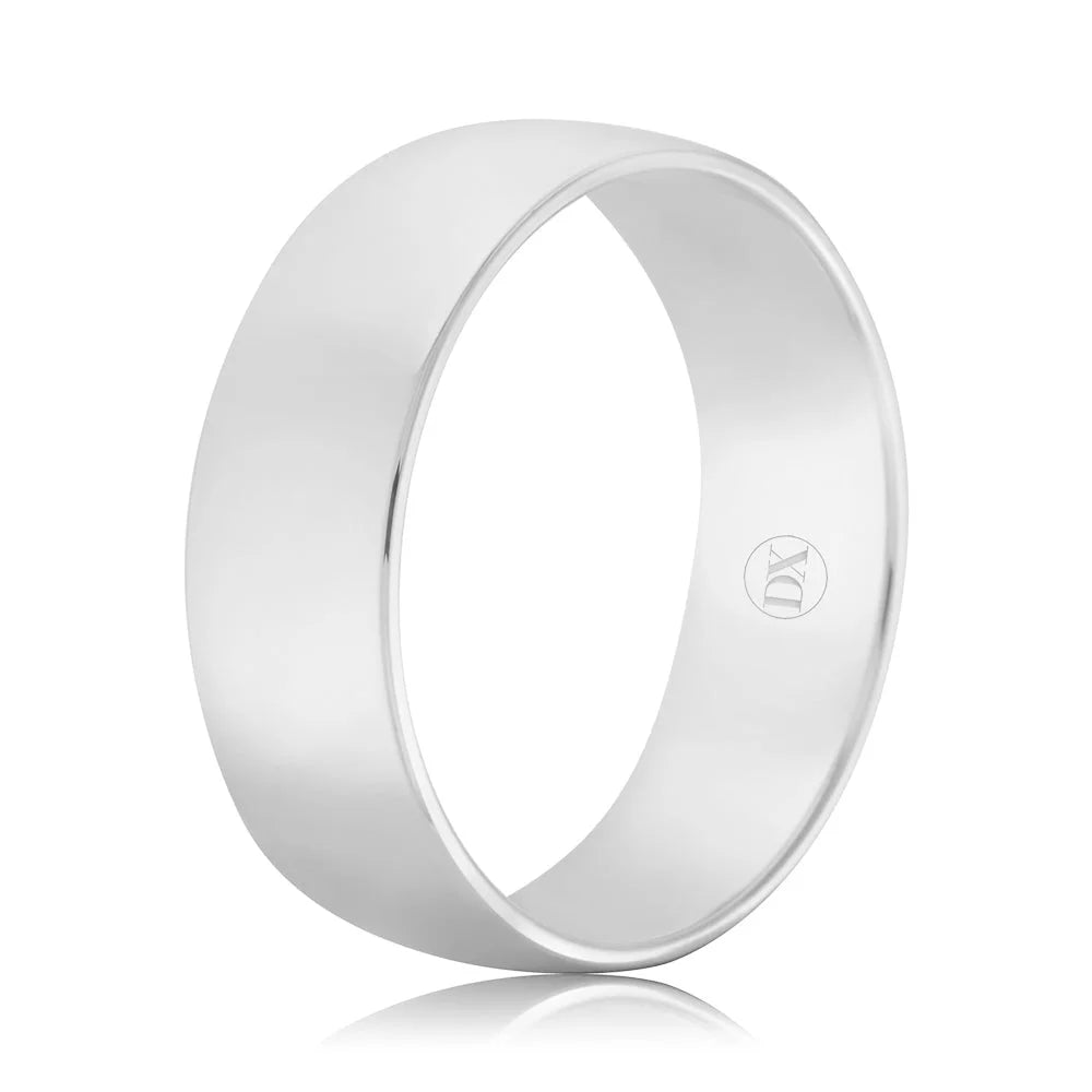 A plain, wide, polished silver ring with a smooth finish and a small engraved logo on the inner band.