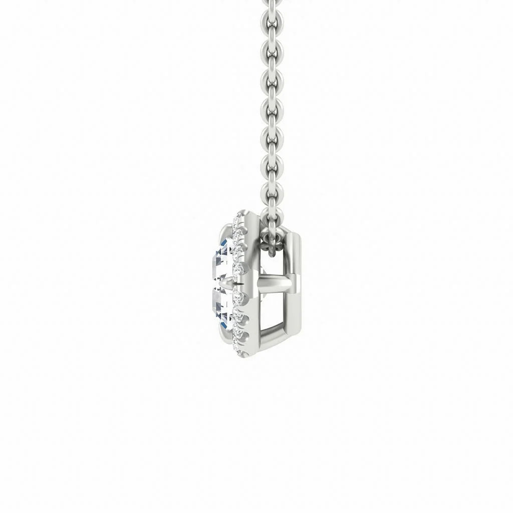 Side view of a silver necklace chain with a gemstone pendant encircled by small clear stones, on a white background.