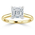 Asscher-cut diamond solitaire set on a simple yellow gold band with four prongs.