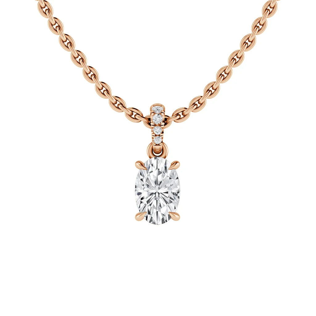 A rose gold chain necklace with an oval diamond pendant and three small round diamonds above the center stone.