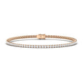 Rose gold tennis bracelet with a single row of round white diamonds and a secure clasp, shown on a white background.