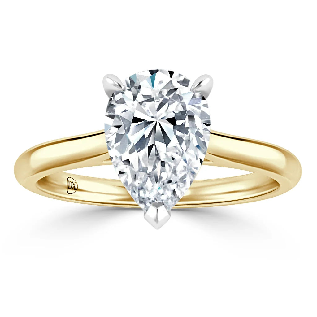 A pear-shaped diamond solitaire ring with a yellow gold band set in a classic prong setting.