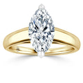 Gold band ring with a large marquise-cut diamond set in a four-prong setting, viewed from the front.