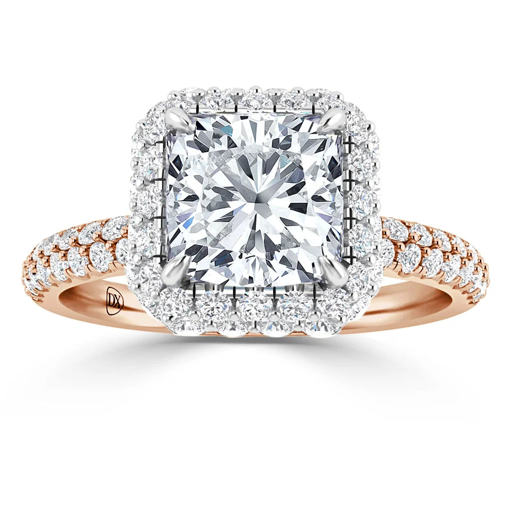 A rose gold ring with a square halo setting, featuring a large central diamond and pavé diamond band.