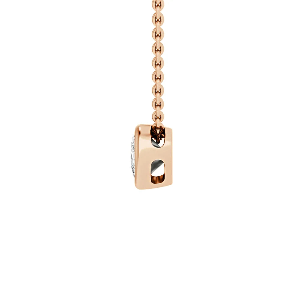A rose gold chain holds a rectangular pendant with a round diamond set on its side, against a white background.
