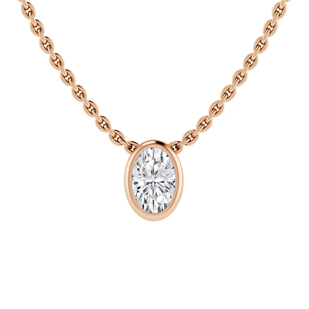 A rose gold chain necklace with an oval diamond pendant in a simple bezel setting, on a white background.