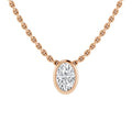 A rose gold chain necklace with an oval diamond pendant in a simple bezel setting, on a white background.