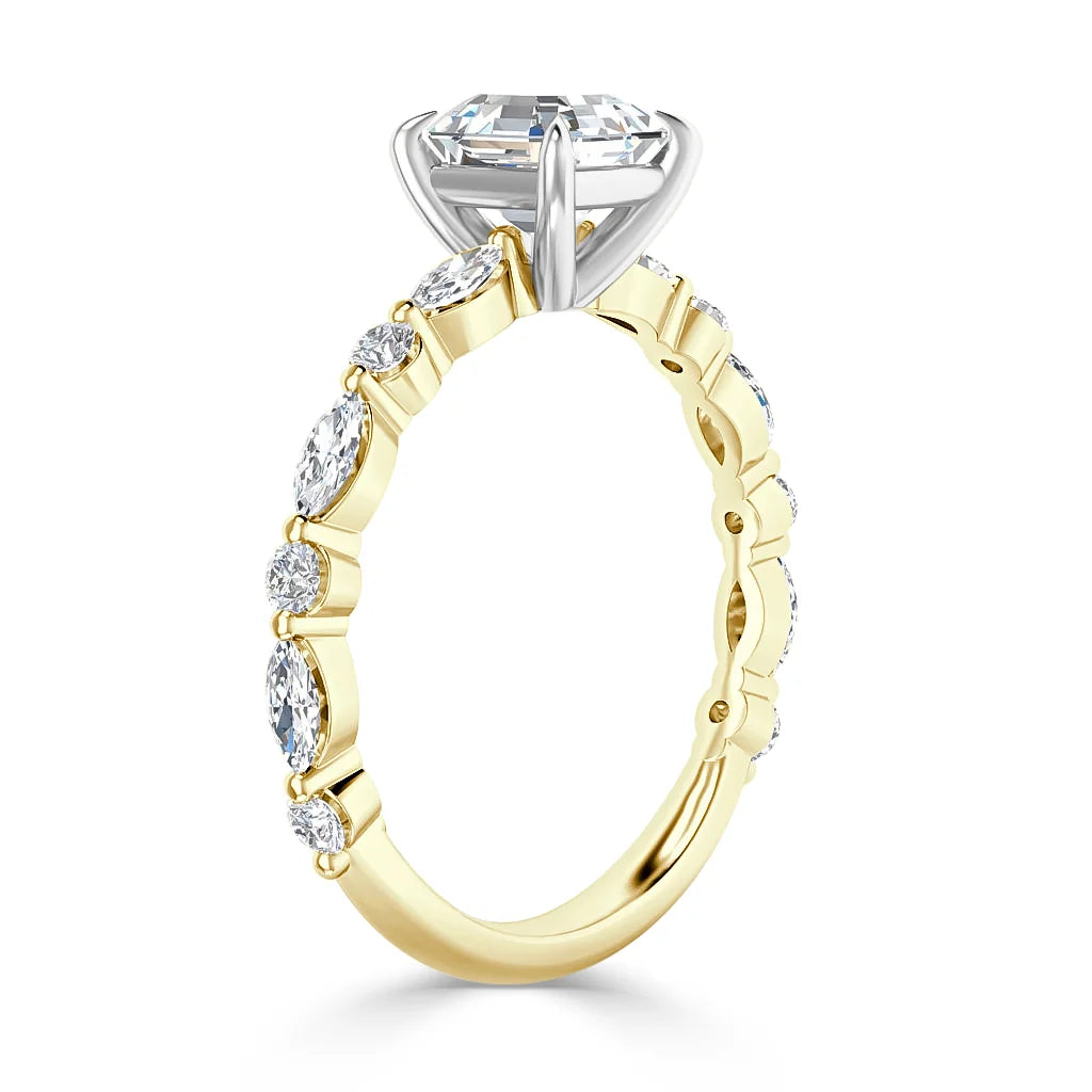 Gold ring with oval diamonds on the band and a large, raised central diamond in a white metal setting.