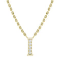 Gold chain necklace with a gold letter I pendant encrusted with small clear gemstones down the center.