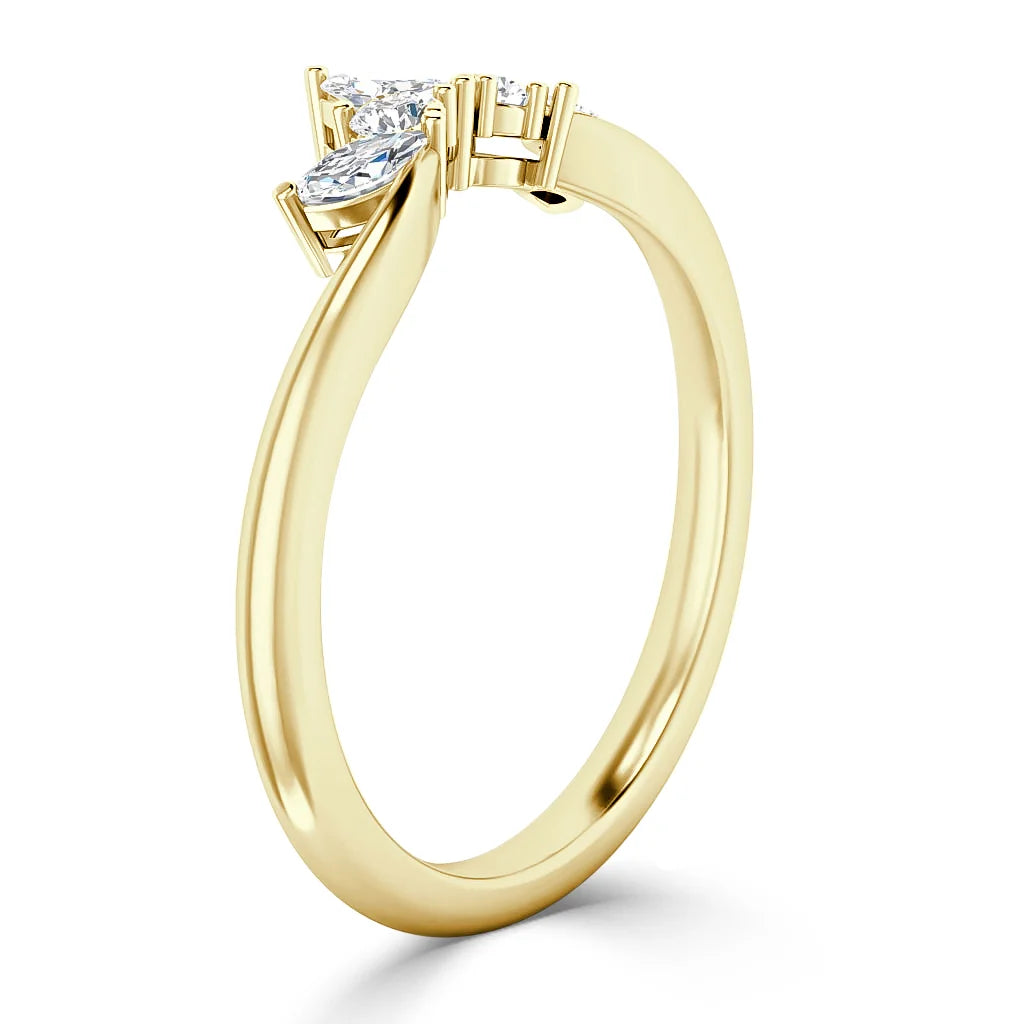 A gold ring with two marquise-cut diamonds set at an angle on a slender, polished band.