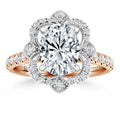 Rose gold ring with a large oval diamond center, floral diamond halo, and diamond-studded band.