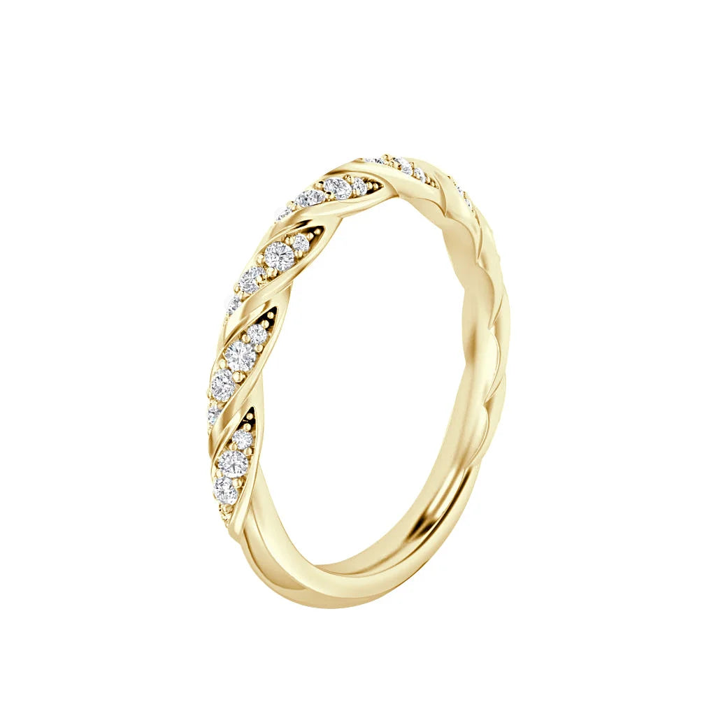 Gold twisted band ring with embedded small diamonds in a leaf-like pattern, on white background.