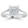 A silver ring with a large, square-cut diamond set in a four-prong solitaire setting.