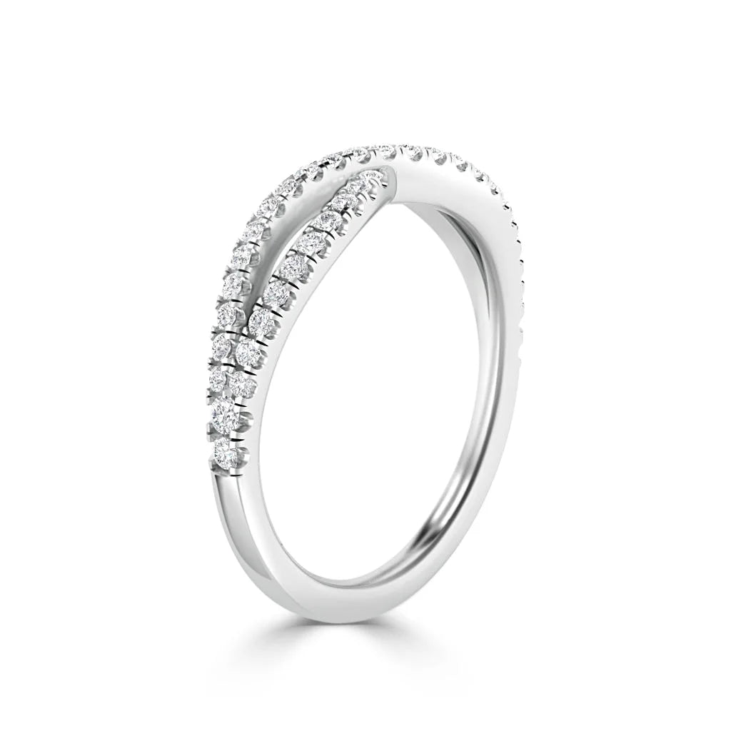 White gold ring with two rows of small round diamonds curving along the top of the band, on a white background.