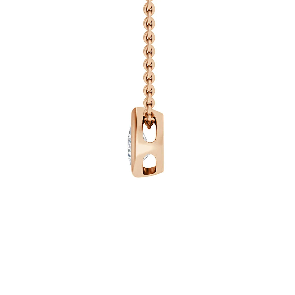 A rose gold chain with a rectangular pendant featuring two open oval cutouts and a vertical inset diamond.