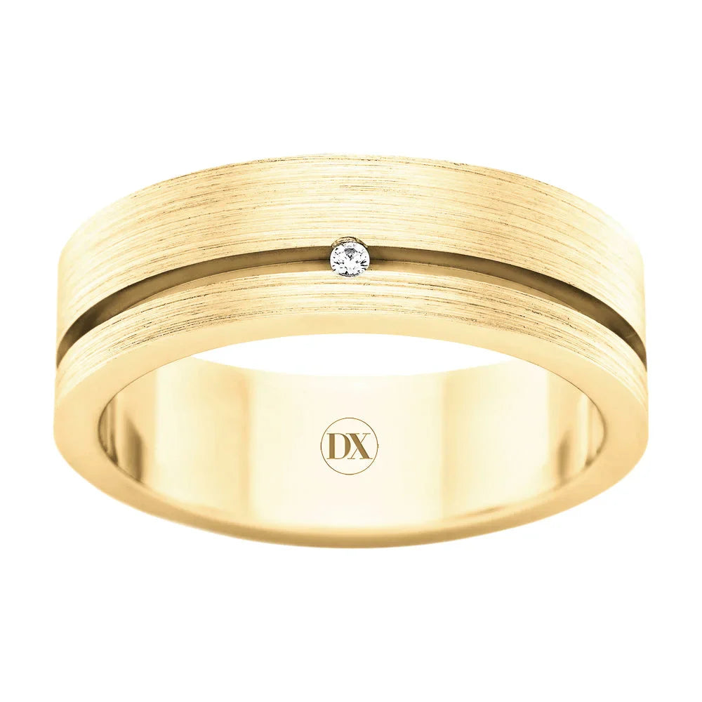 Wide gold ring with a brushed finish, a central groove, and a single small diamond set in the center.