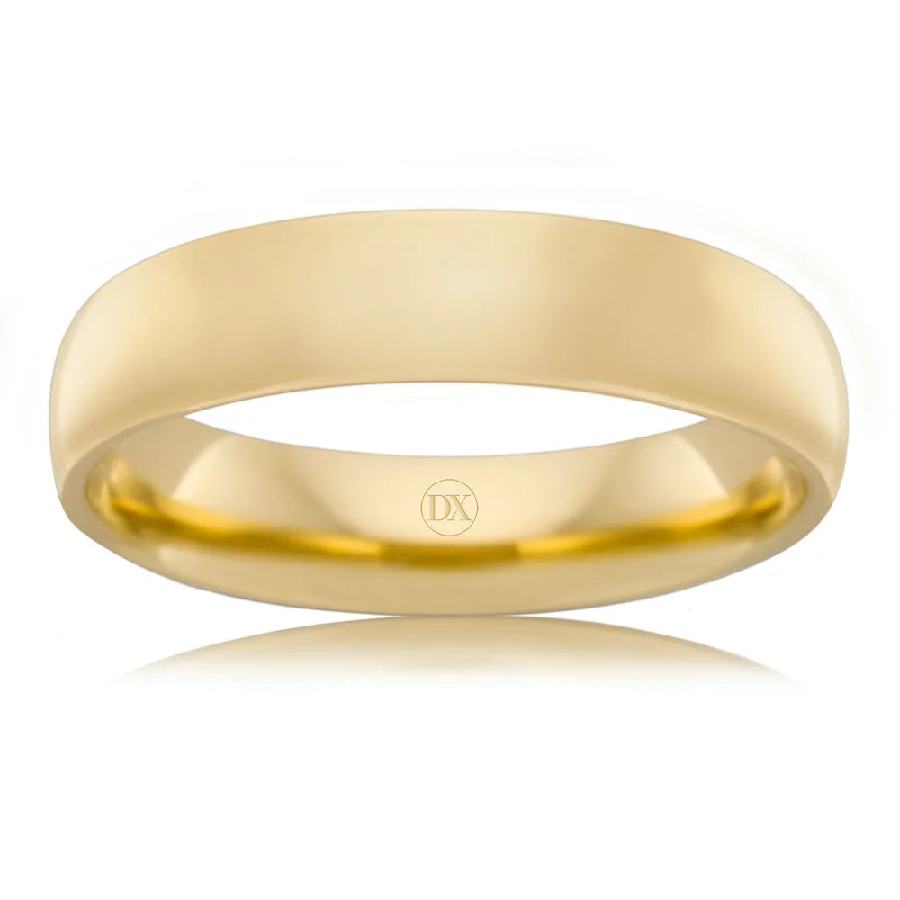 A plain, polished yellow gold wedding band with a smooth finish and a small DX engraving inside.