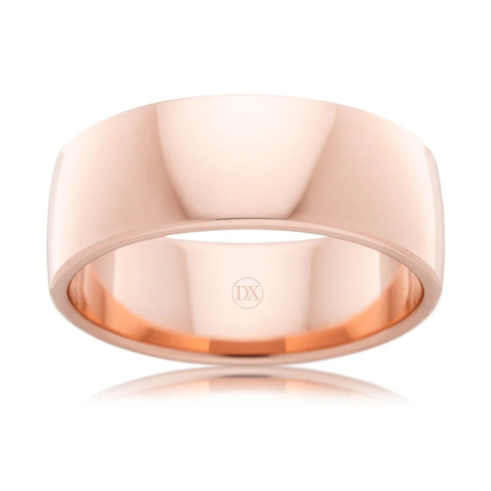Wide, polished rose gold ring with a smooth surface, viewed from the front against a white background.
