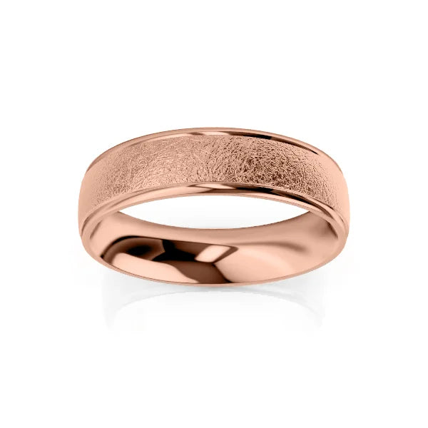 A rose gold ring with a brushed, textured center and polished edges on a white background.