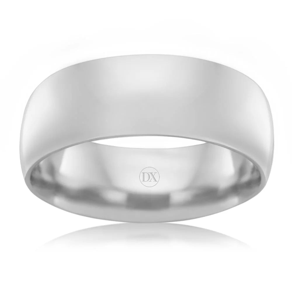 A plain, polished silver ring with a smooth, wide band and DX engraved inside the band.