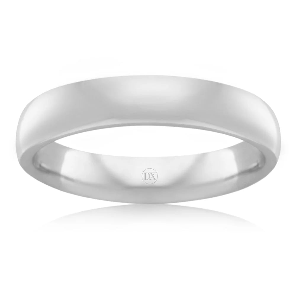 A simple, polished silver band ring with a smooth surface and DX engraved on the inner side.