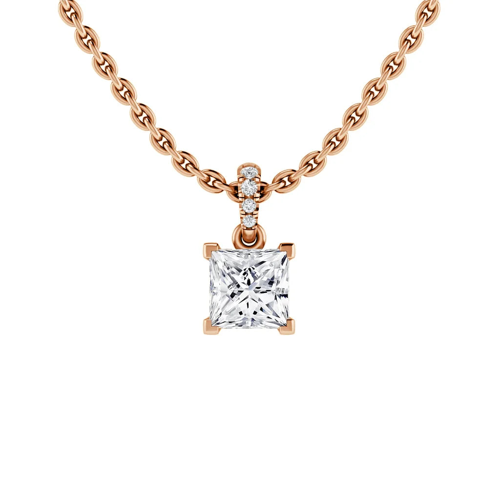 Rose gold chain necklace with a square diamond pendant and three small round diamonds above the main stone.