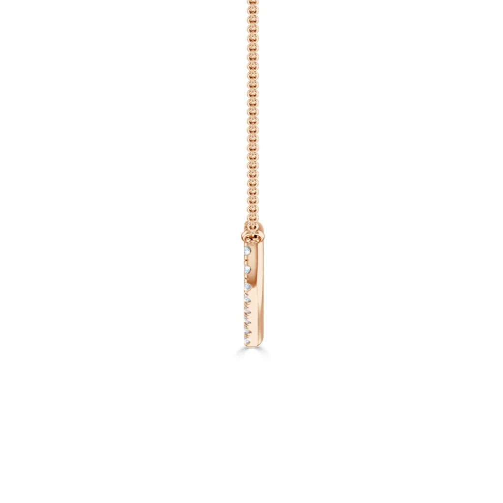 Rose gold necklace with a thin vertical bar pendant accented by small round diamonds, on a fine chain.