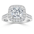 Platinum ring with a cushion-cut center diamond, halo setting, and diamonds on the band.