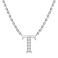 Silver chain necklace with a capital letter T pendant encrusted with small clear gemstones.