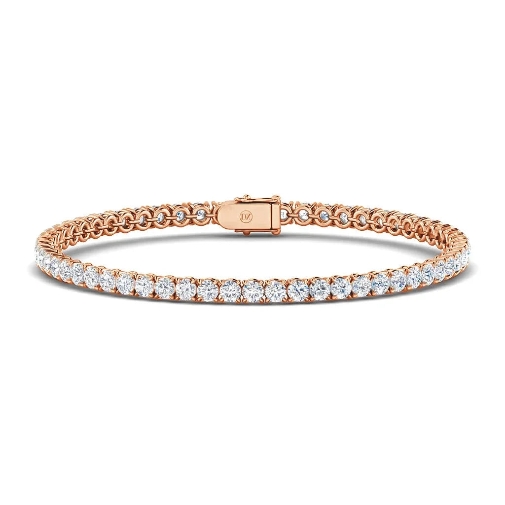 The Monica 18ct Rose Gold tennis bracelet by DX Diamonds features an elegant row of evenly spaced diamonds and a secure clasp.