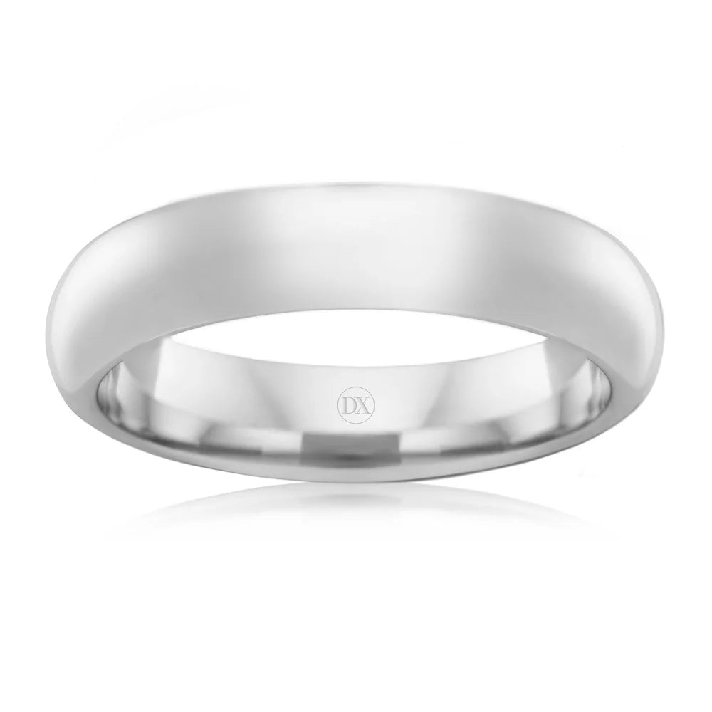Simple, polished silver wedding band with a smooth, rounded surface and “DX” engraved inside.