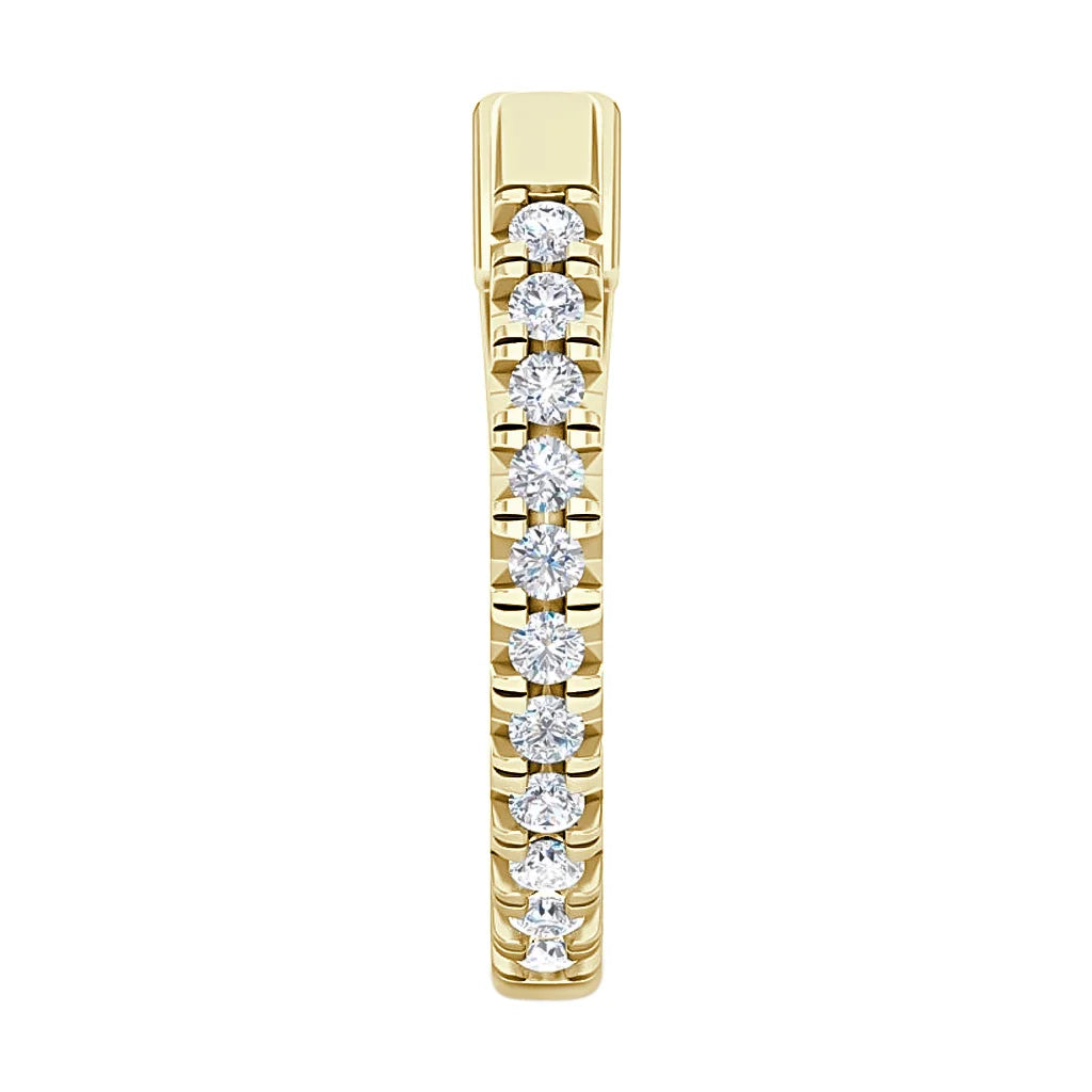 Gold ring band with a row of white round diamonds set in a straight line along the top.