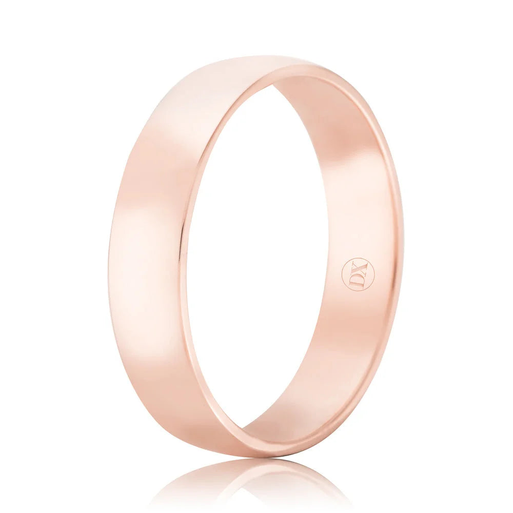 A simple, polished rose gold band ring with a smooth surface and a small engraved logo inside.
