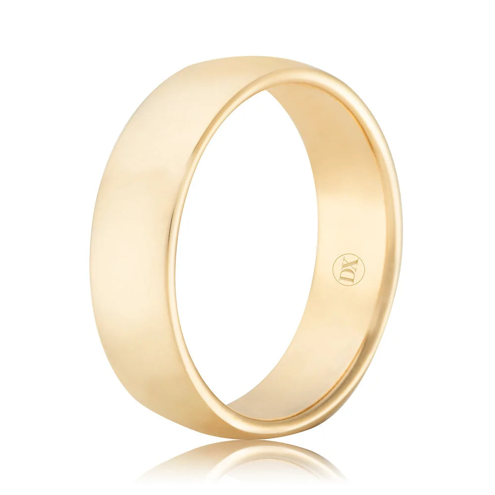 A plain, polished gold band ring with a smooth surface and a small engraved logo inside.