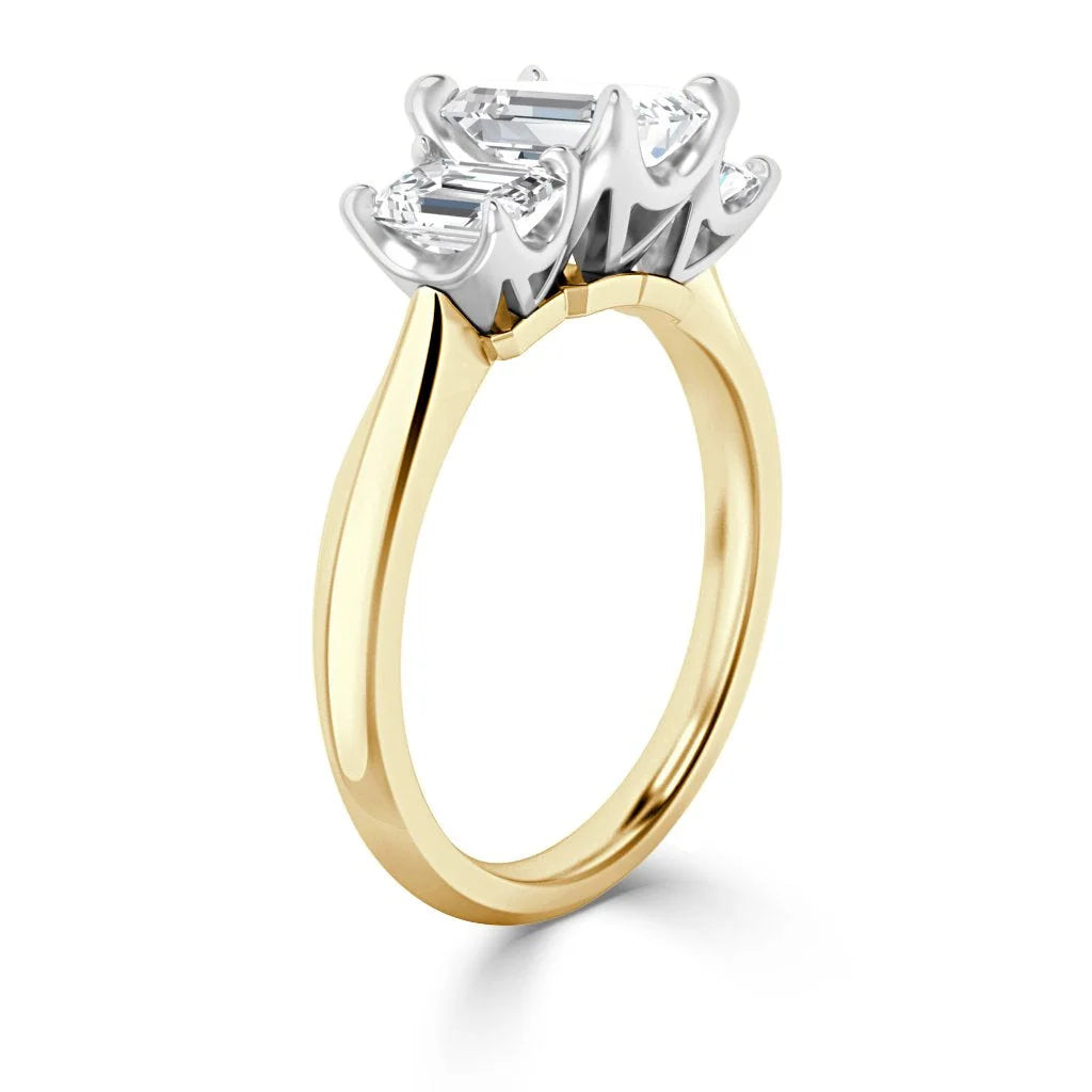 Gold ring with two prong-set diamonds in a white metal setting, shown from a side view on a white background.