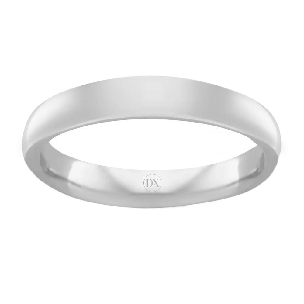 A plain, polished silver ring with a flat profile and a small DX engraving on the inner band.