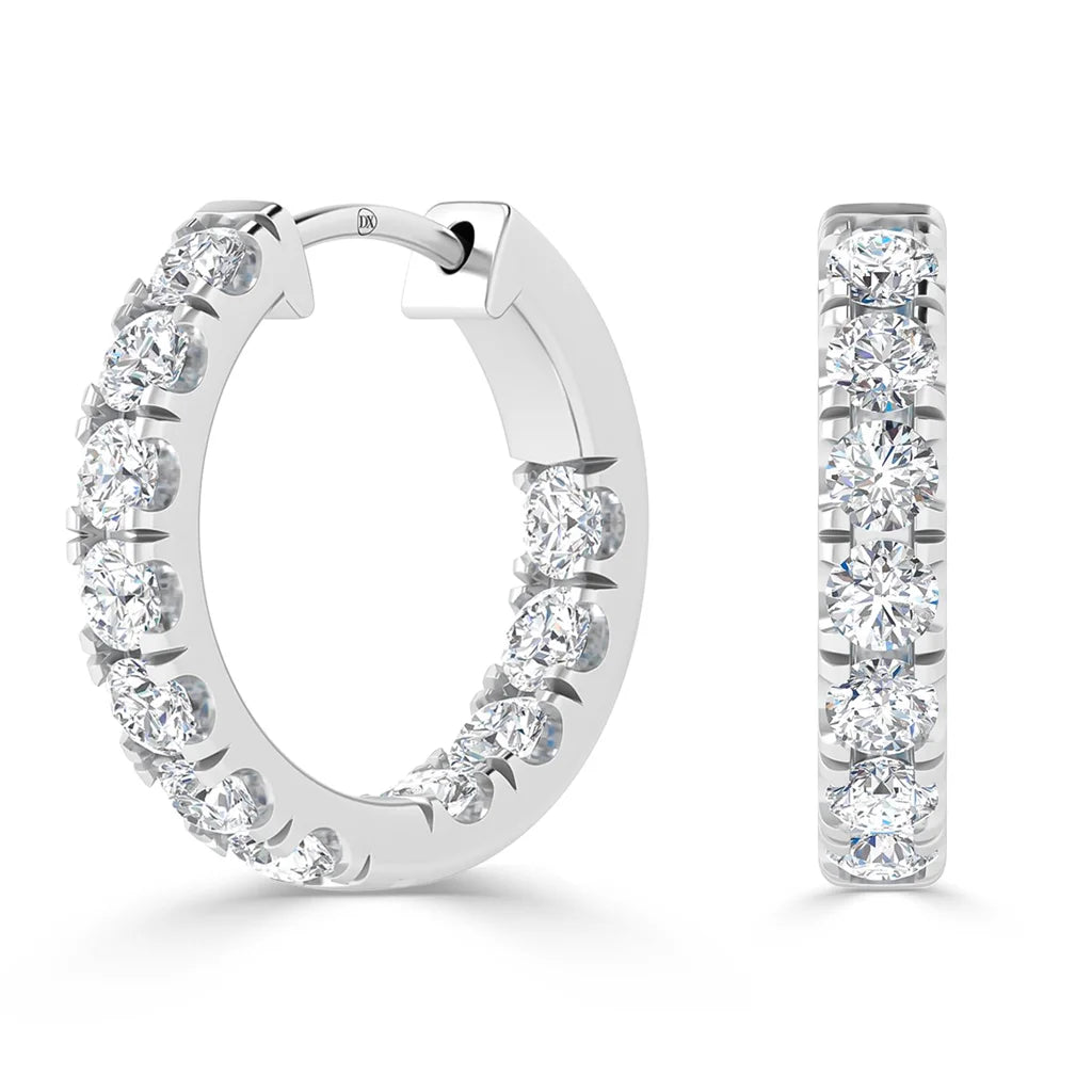 Two silver hoop earrings encrusted with round white diamonds, shown from front and angled side views.