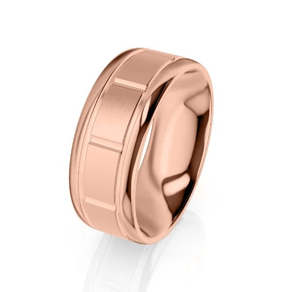 A wide, polished rose gold ring with a brushed center band and subtle rectangular grooves.