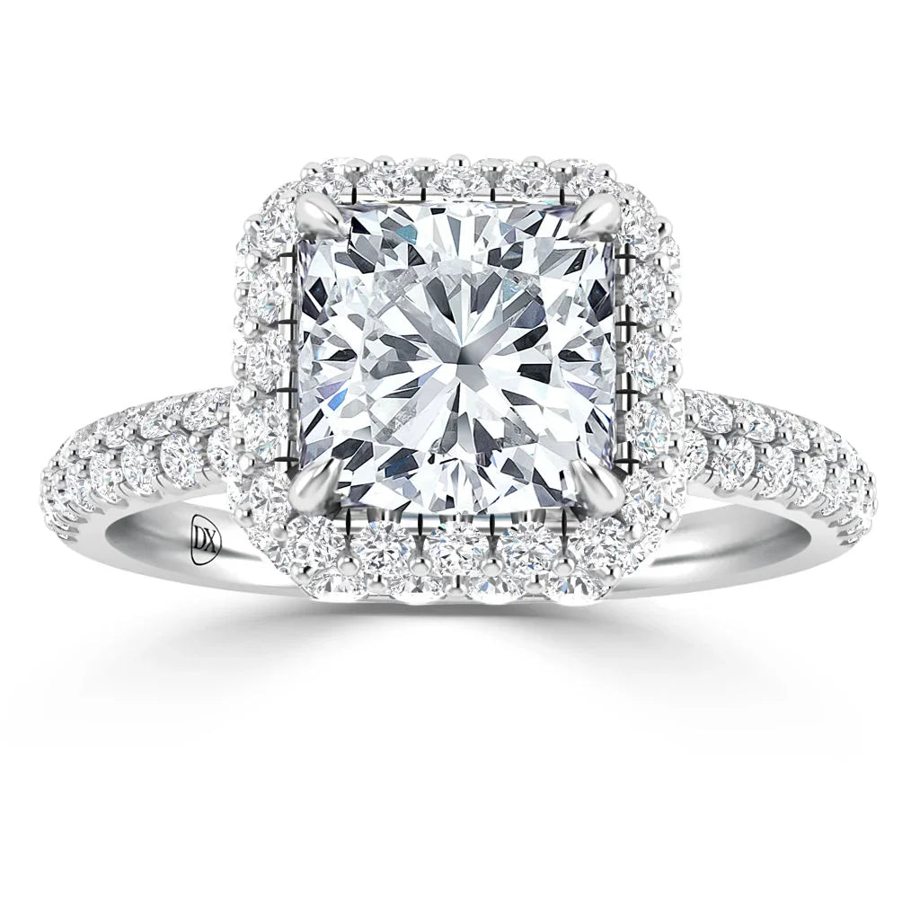 A square halo diamond ring with a pavé band, featuring a large center diamond set in white metal.