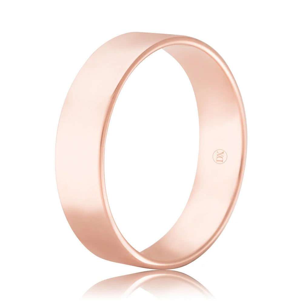 A plain, polished rose gold ring with a flat surface, reflecting light, on a white background.