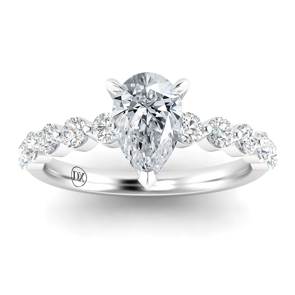 Pear-shaped diamond ring with round side stones on a silver band, viewed from the front.