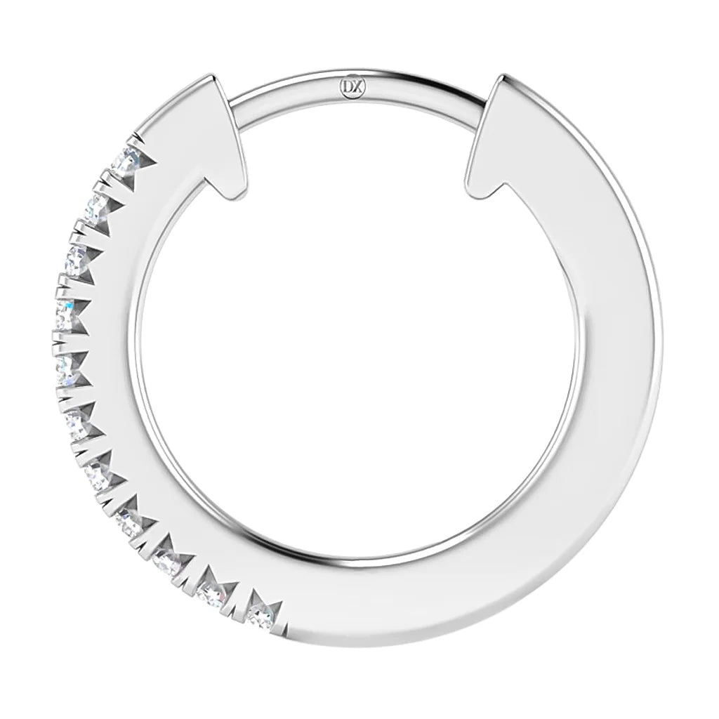 A silver hoop earring with small clear gemstones set along one side of the circular design.