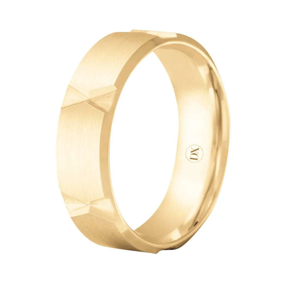 A gold band ring with a brushed finish and geometric bowtie-shaped cutout patterns around the exterior.