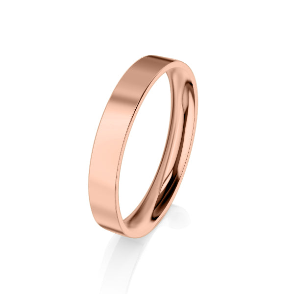 A simple, polished rose gold ring with a flat, smooth surface on a white background.
