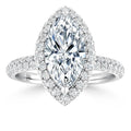 Marquise-cut diamond ring with a double halo of smaller diamonds on a pavé diamond band, shown on white background.