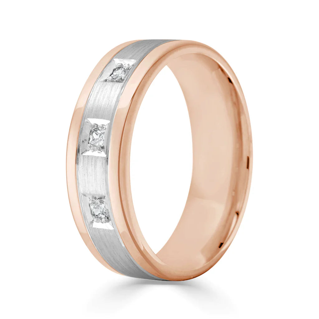 Rose gold ring with a brushed silver center band, set with three square-cut diamonds in a row.
