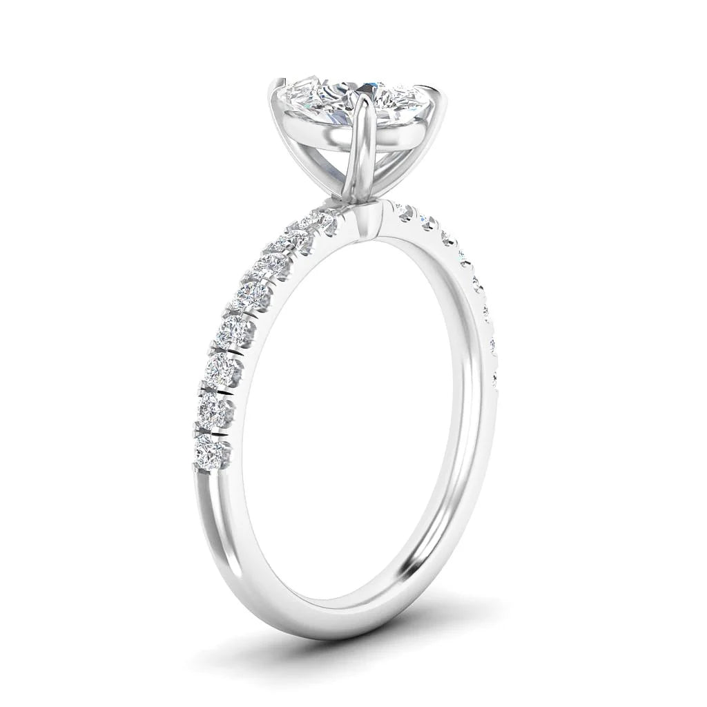 A silver ring with a large round diamond center stone and small diamonds along the band, shown on a white background.