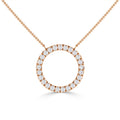 Gold necklace with a circular pendant encrusted with small, sparkling diamonds on a fine chain.