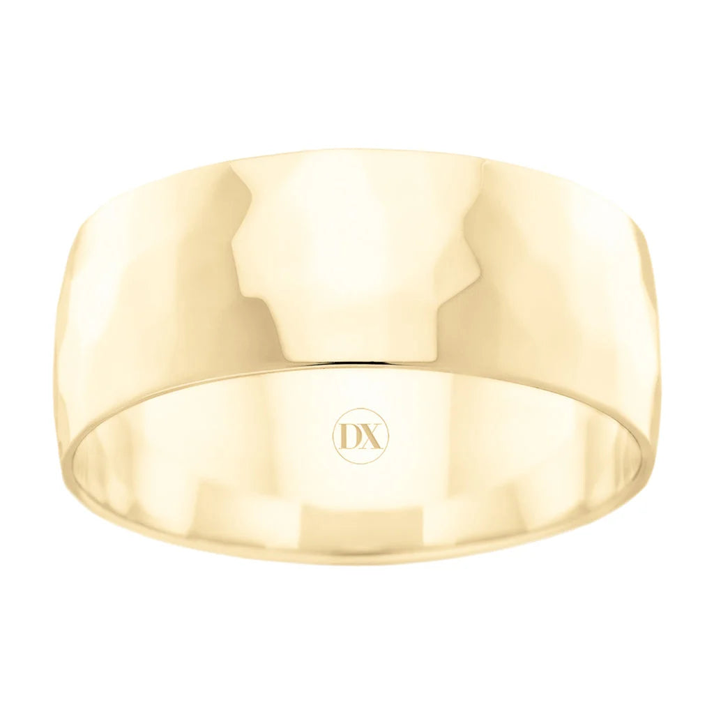 Wide, polished yellow gold ring with subtle hammered texture and DX engraved inside the band.