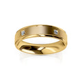 A gold ring with a matte finish and two small round diamonds set apart on its flat band.